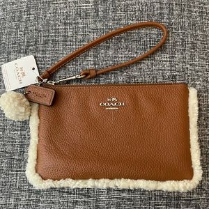 COACH New With Tag Saddle Brown Textured Leather Shearling Edge Small Wristlet